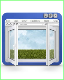 A PC screen with an opening window. In the background is green grass.